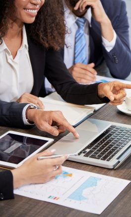 Corporate-crop-businesspeople-using-laptop-scaled.jpg